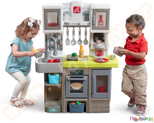 Σύγχρονη Παιδική Κουζίνα της Step2, με διαδραστική ηλεκτρονική εστία. Διαθέτει αποθηκευτικό χώρο και 25 αξεσουάρ κουζίνας.